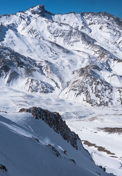skiing one of the best lines in Las Leñas with Cerro Leñas in the background