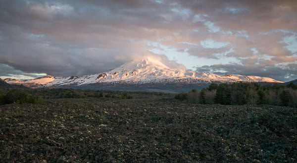 Llaima volcano and its many lava rocks